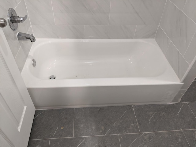 bathroom with a tub to relax in