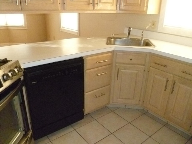 kitchen featuring light brown cabinets, sink, electric range oven, and black dishwasher