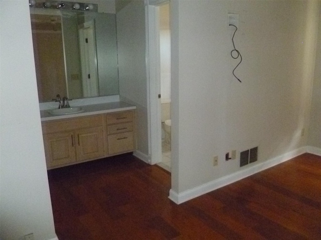 bathroom with vanity and hardwood / wood-style flooring