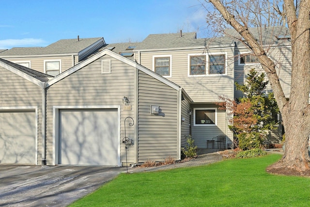 rear view of house featuring a yard