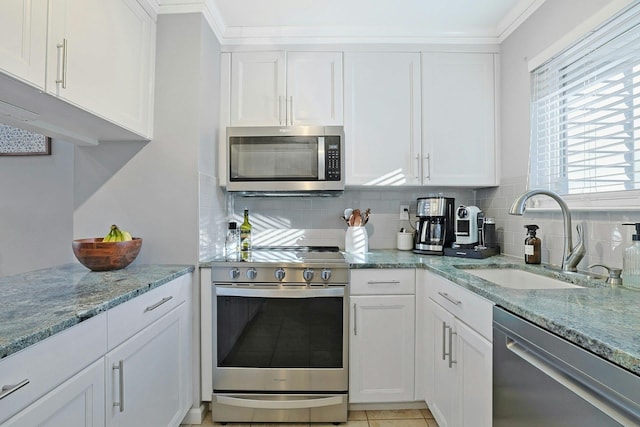 kitchen with white cabinetry, appliances with stainless steel finishes, and sink