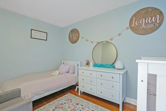 bedroom featuring wood-type flooring