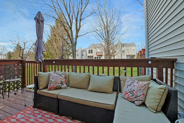 deck featuring an outdoor hangout area and a yard