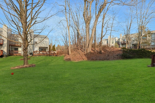 view of yard featuring a wooden deck