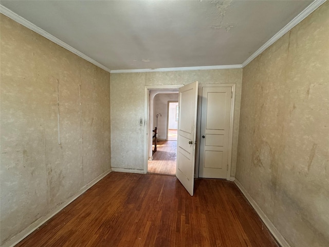 unfurnished room with dark hardwood / wood-style floors and ornamental molding