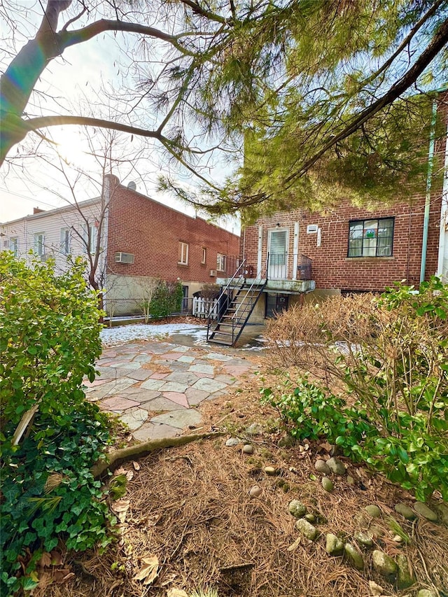 rear view of property featuring a patio