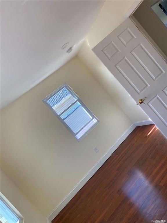 interior space with dark hardwood / wood-style floors