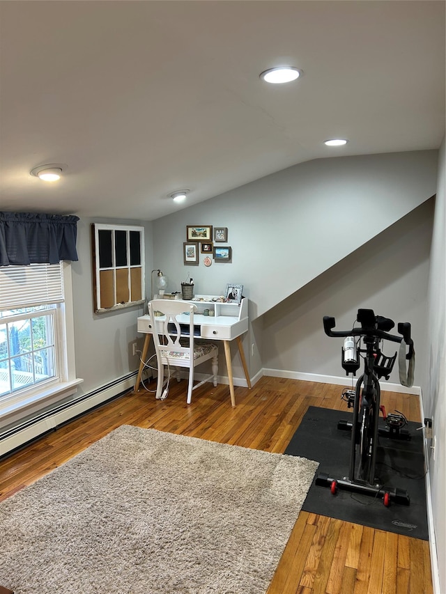 office with hardwood / wood-style floors and lofted ceiling