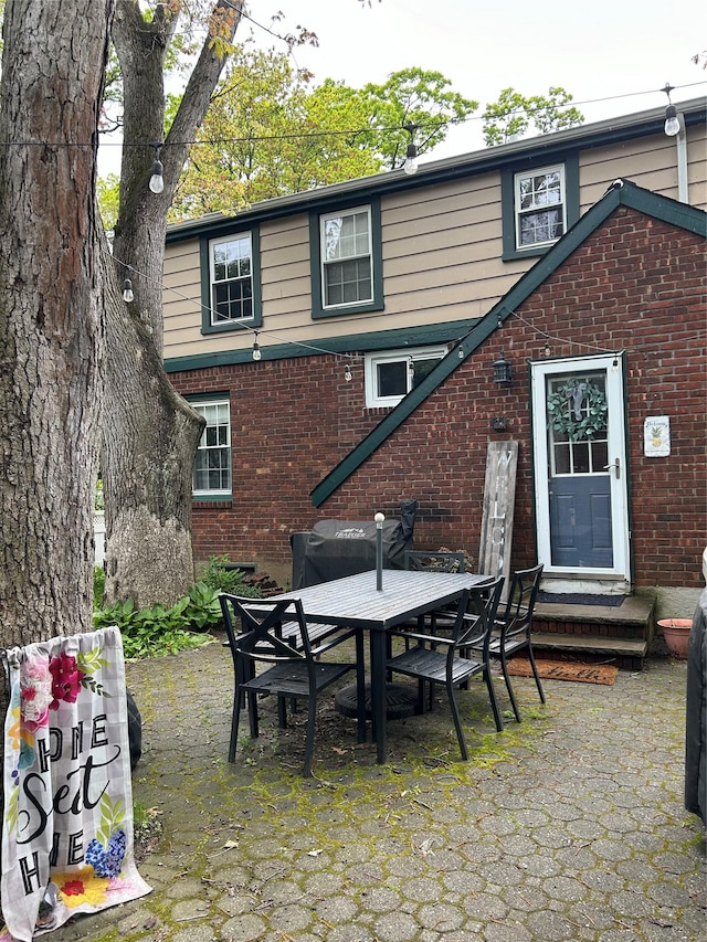 back of property featuring a patio