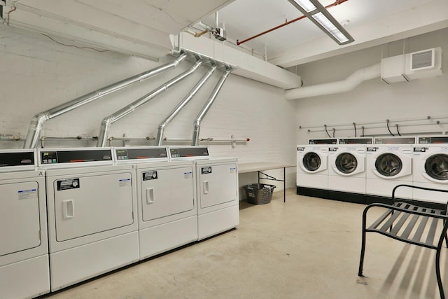 laundry area with washing machine and dryer