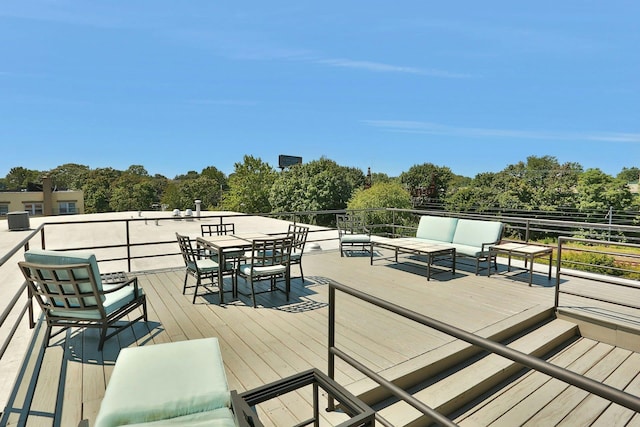 wooden deck featuring outdoor lounge area