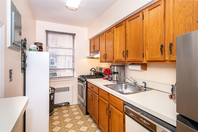 kitchen featuring sink, stainless steel appliances, and radiator