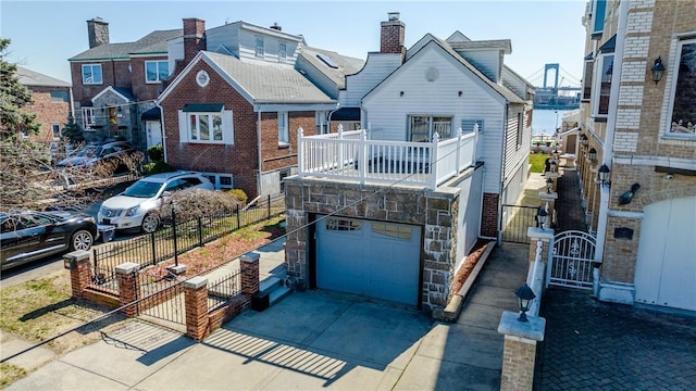 view of front facade with a balcony and a garage