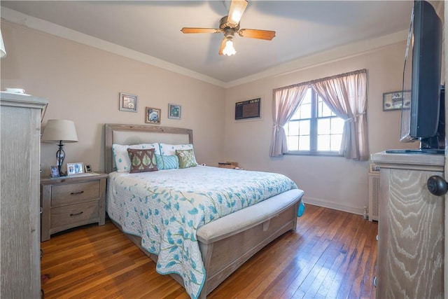 bedroom with ceiling fan, crown molding, and dark hardwood / wood-style floors