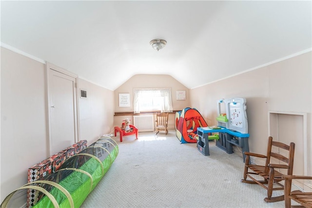 rec room with carpet floors and vaulted ceiling