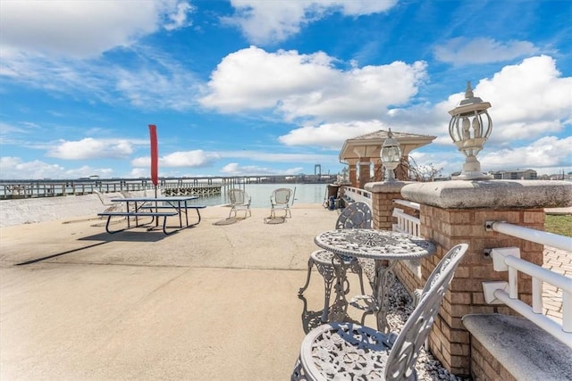 view of patio / terrace with a water view