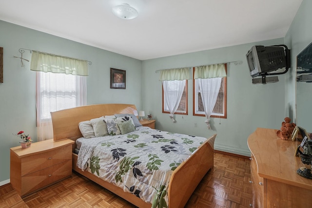 bedroom featuring parquet flooring