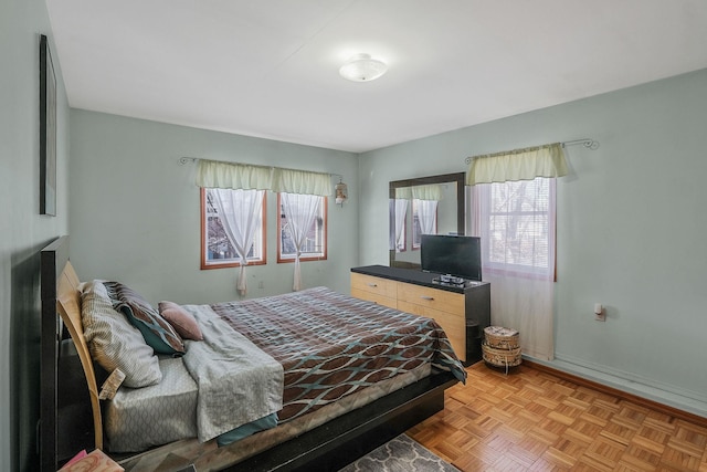 bedroom with light parquet floors