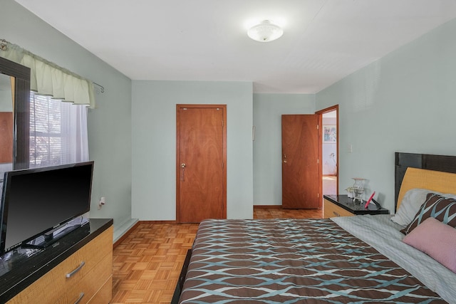 bedroom featuring light parquet floors