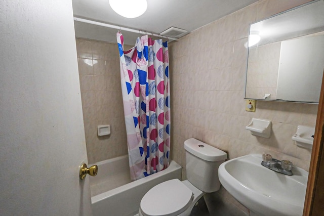 full bathroom with decorative backsplash, shower / tub combo with curtain, sink, tile walls, and toilet