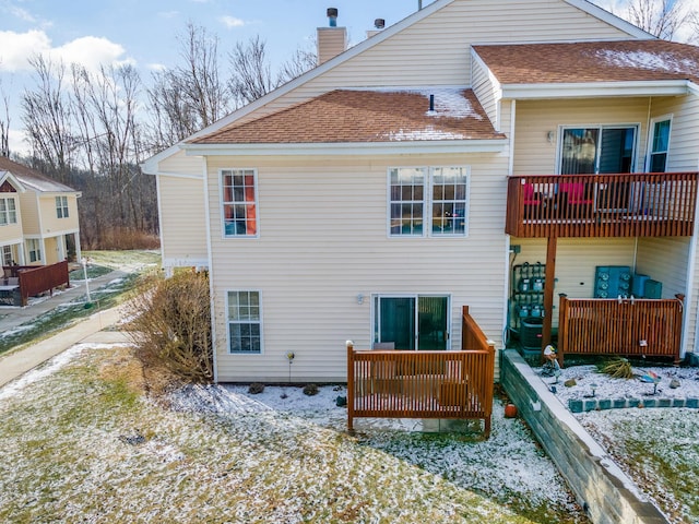 back of property featuring a balcony