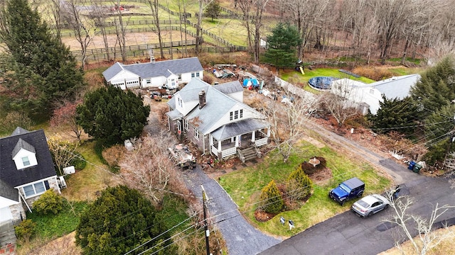 birds eye view of property with a rural view