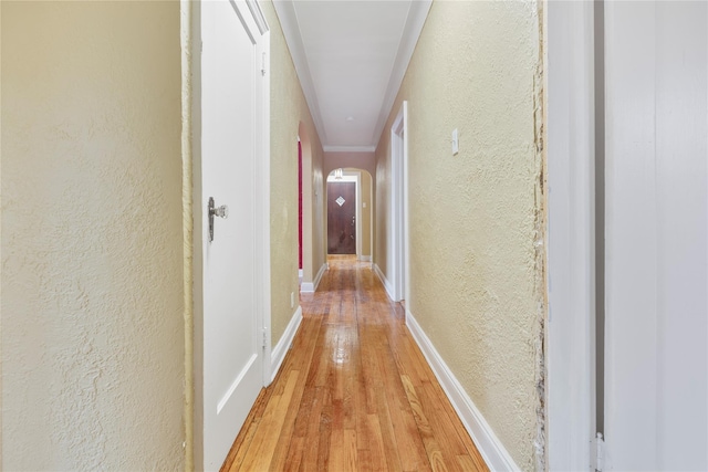 corridor with light hardwood / wood-style flooring