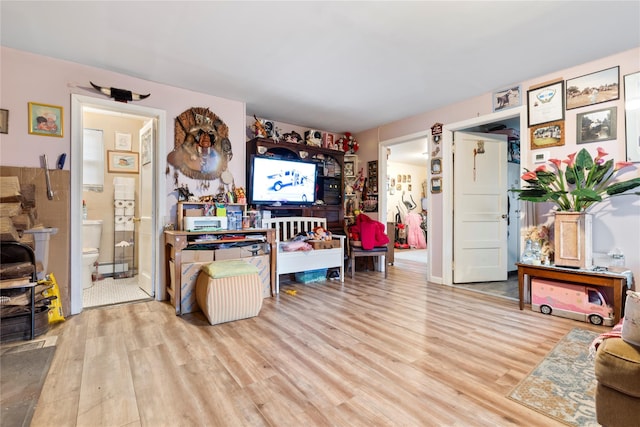 interior space with light wood-type flooring and a baseboard radiator