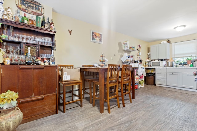 dining area with light hardwood / wood-style floors