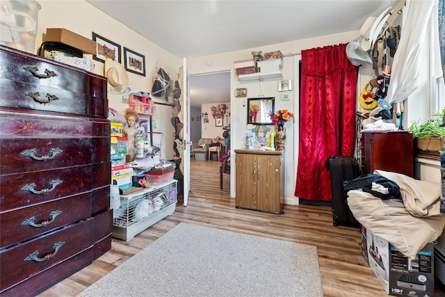 bedroom with light wood-type flooring