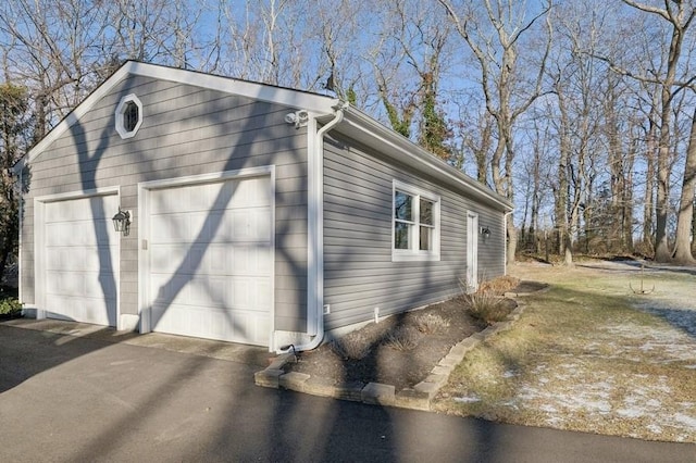 view of side of property featuring a garage