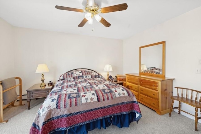 bedroom featuring light colored carpet, ceiling fan, and a baseboard heating unit