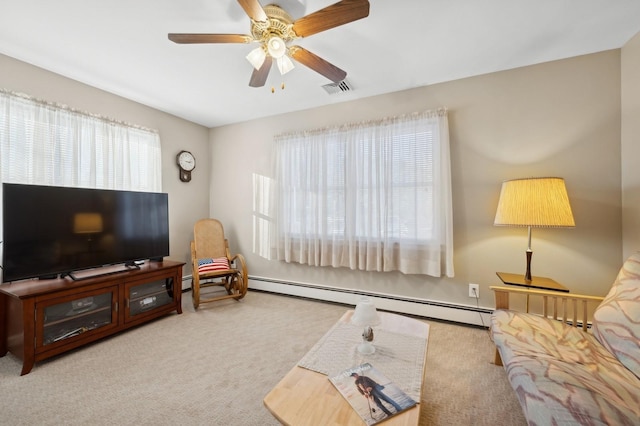 living room with light colored carpet, baseboard heating, and ceiling fan