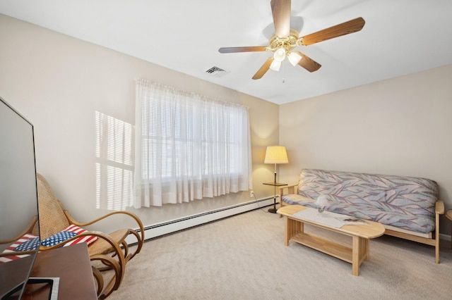 sitting room featuring carpet flooring, ceiling fan, and a baseboard heating unit