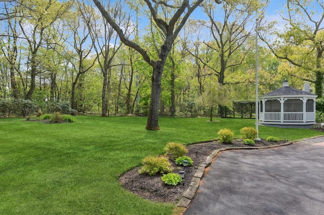 view of green lawn featuring a gazebo