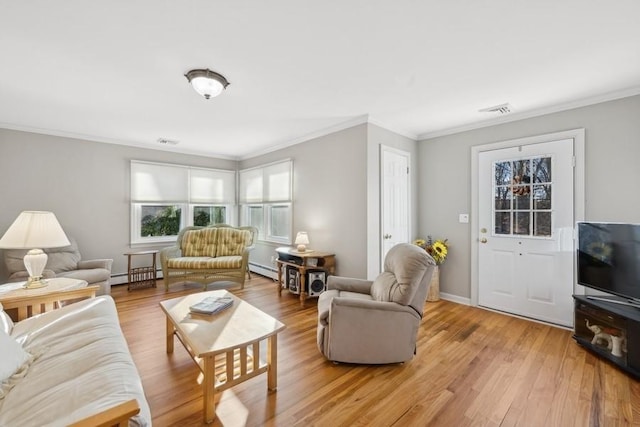 living area with ornamental molding, light wood-type flooring, baseboard heating, and visible vents