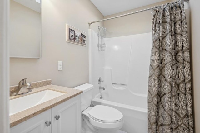 bathroom featuring shower / bath combo with shower curtain, toilet, and vanity