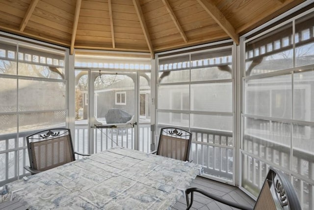 sunroom / solarium with outdoor dining area