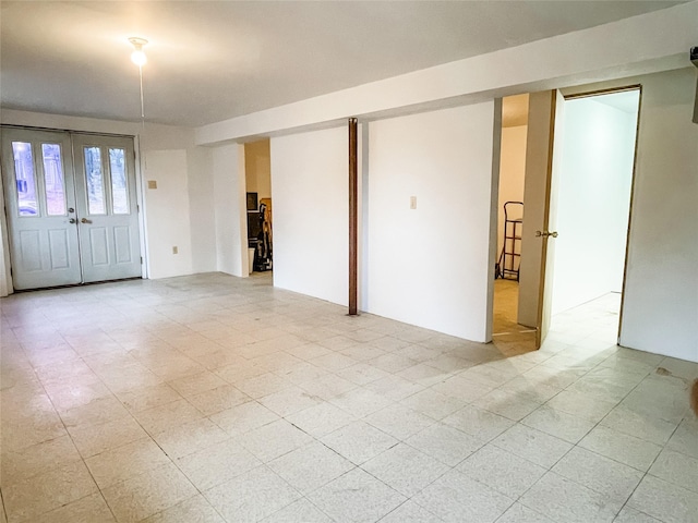 spare room featuring french doors