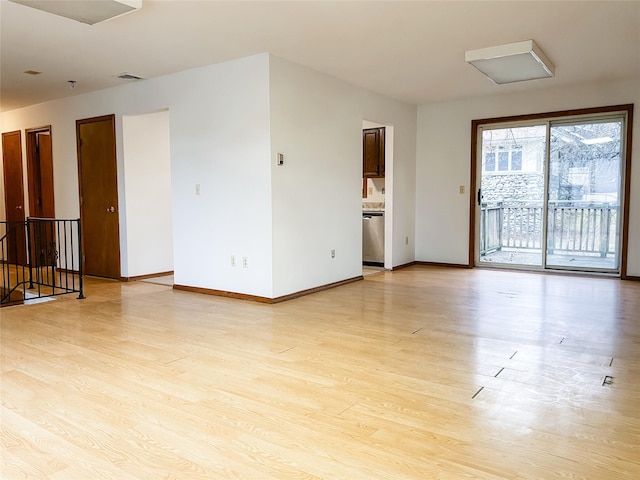 unfurnished room with light hardwood / wood-style floors