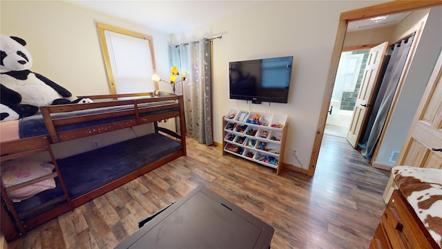 bedroom featuring wood-type flooring