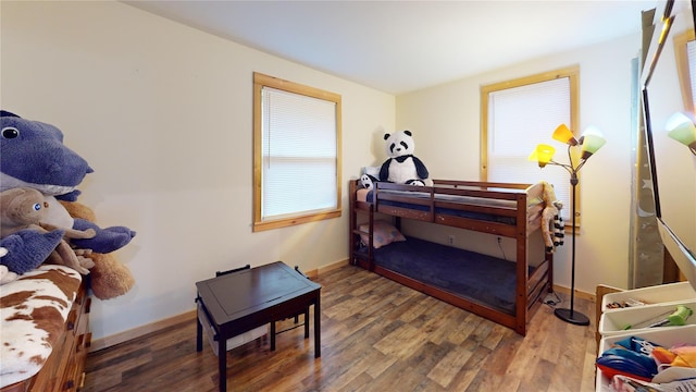 bedroom featuring dark hardwood / wood-style flooring