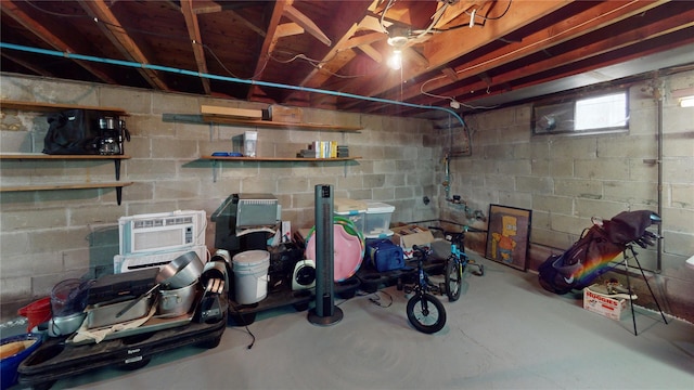 basement featuring a wall mounted AC