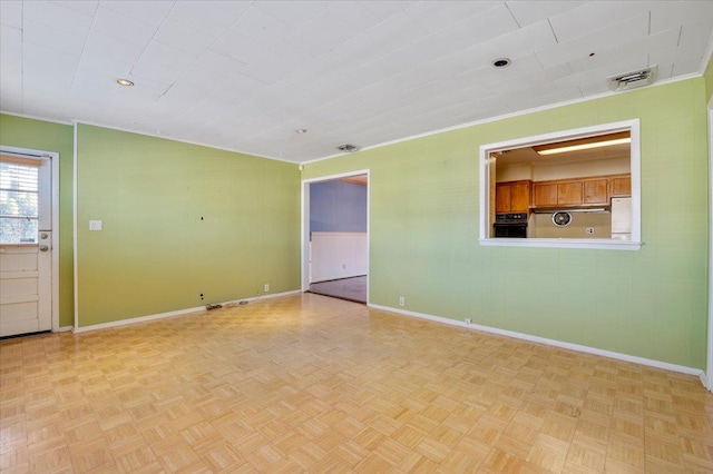 unfurnished room featuring light parquet floors