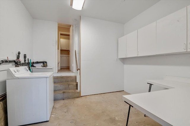 laundry room with cabinets and washer / dryer