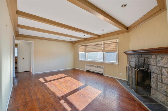 unfurnished living room featuring beam ceiling, radiator, a stone fireplace, and dark hardwood / wood-style floors