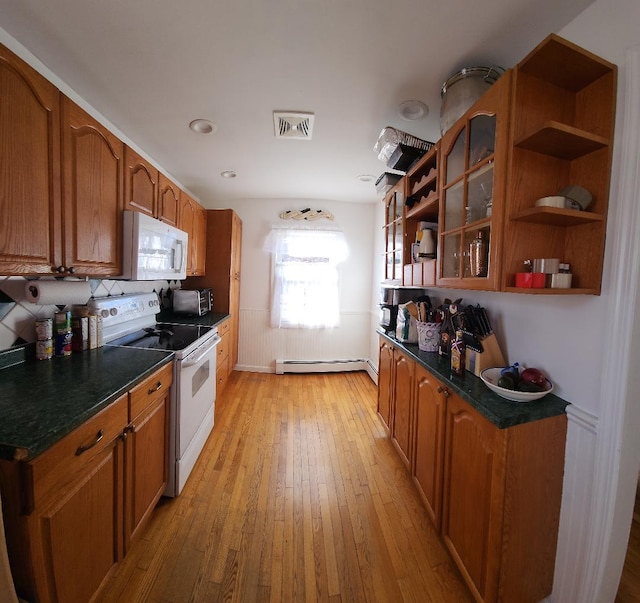 kitchen featuring baseboard heating, white appliances, and light wood-type flooring