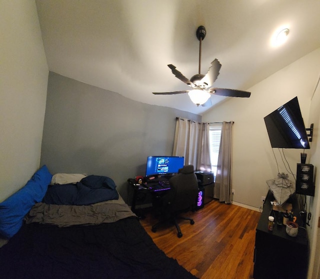 bedroom featuring vaulted ceiling, ceiling fan, and dark hardwood / wood-style floors