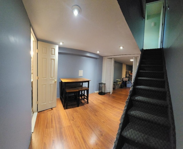 stairs with hardwood / wood-style floors