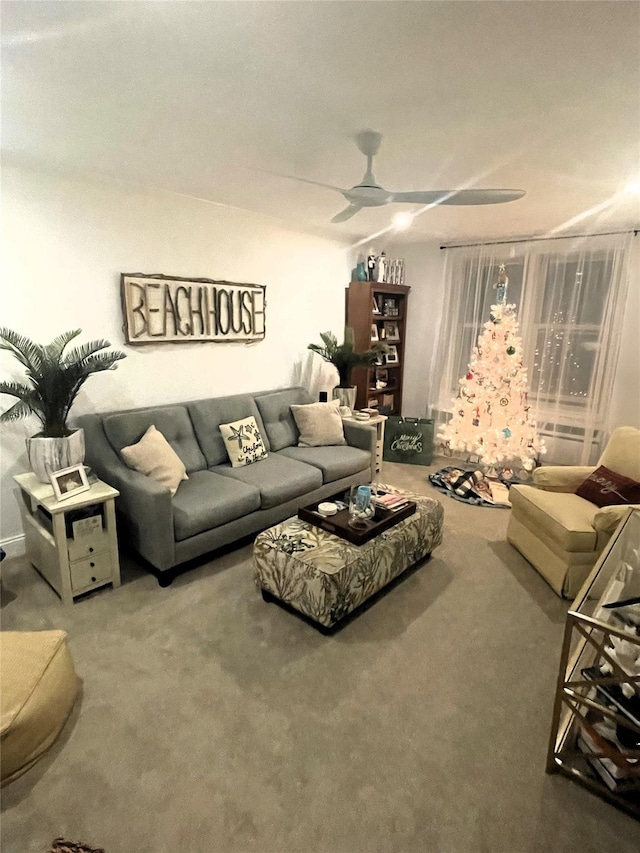 living room with carpet floors and ceiling fan